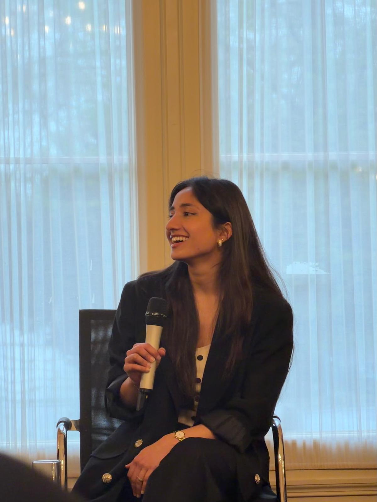 Eshal Rehman speaking at an event